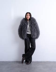 Model wearing Faux mongolian fur bomber coat in grey