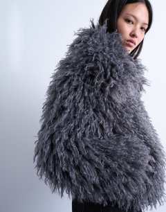 Model wearing Faux mongolian fur bomber coat in grey