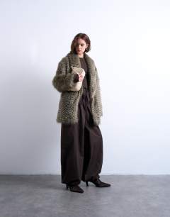 Model wearing Faux mono stripe shawl mid length coat in black