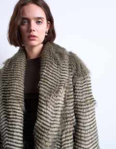 Model wearing Faux mono stripe shawl mid length coat in black