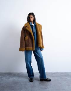 Model wearing Faux shearling oversized car coat in brown