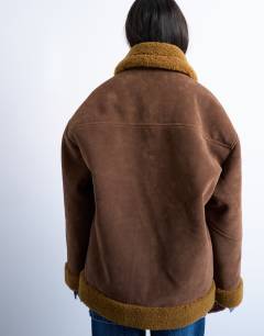 Model wearing Faux shearling oversized car coat in brown