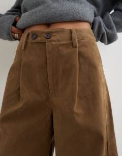 Model wearing Faux suede barrel leg trouser in choc