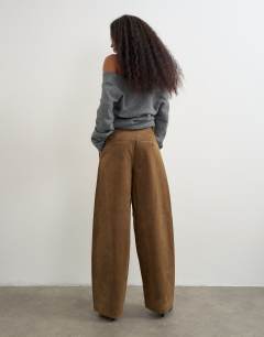 Model wearing Faux suede barrel leg trouser in choc