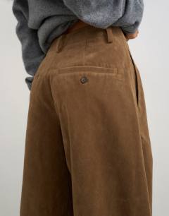 Model wearing Faux suede barrel leg trouser in choc
