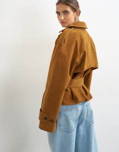 Model wearing Faux suede belted trench in tan