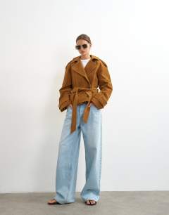 Model wearing Faux suede belted trench in tan
