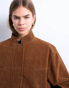 Model wearing Faux suede bomber jacket with nero collar in tan