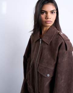 Model wearing Faux suede bomber jacket with popper details in chocolate