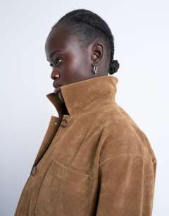 Model wearing Faux suede boxy casual shacket in tan
