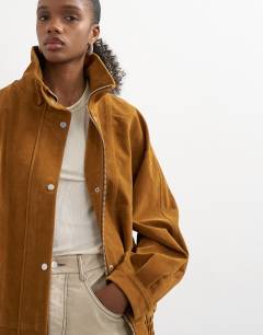 Model wearing Faux suede funnel neck bomber jacket in tan