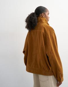Model wearing Faux suede funnel neck bomber jacket in tan