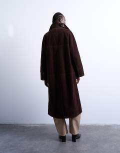 Model wearing Faux suede long car coat with neck tab in brown