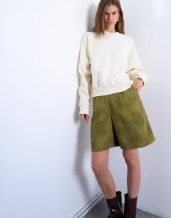 Model wearing Faux suede longline short in green