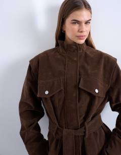 Model wearing Faux suede low belted funnel neck jacket in brown