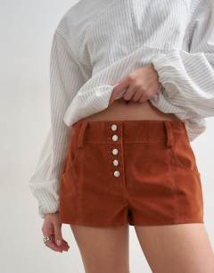 Model wearing Faux suede micro short in rust