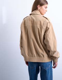 Model wearing Faux suede oversized bomber in stone