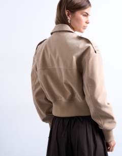 Model wearing Faux suede ovoid sleeve bomber jacket in stone