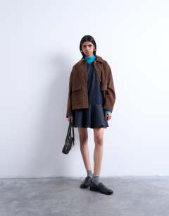 Model wearing Faux suede patch pocket boxy jacket in brown