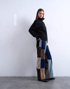 Model wearing Faux suede patchwork cinch trousers in blue