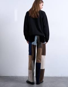 Model wearing Faux suede patchwork cinch trousers in blue