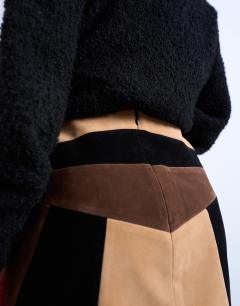 Model wearing Faux suede patchwork mini skirt in brown
