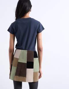 Model wearing Faux suede patchwork mini skirt in multi