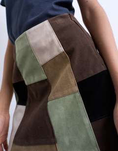Model wearing Faux suede patchwork mini skirt in multi