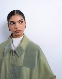 Model wearing Faux suede patchwork zip through jacket in green