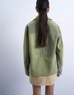 Model wearing Faux suede patchwork zip through jacket in green