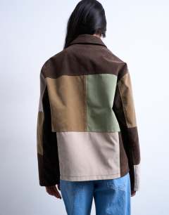 Model wearing Faux suede patchwork zip through jacket in multi