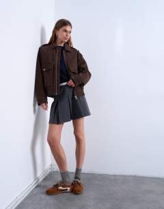Model wearing Faux suede quilted lined bomber jacket with popper details in chocolate