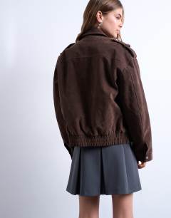 Model wearing Faux suede quilted lined bomber jacket with popper details in chocolate