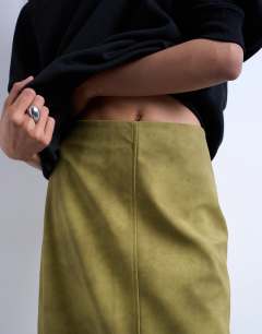 Model wearing Faux suede seamed midi skirt in avocado