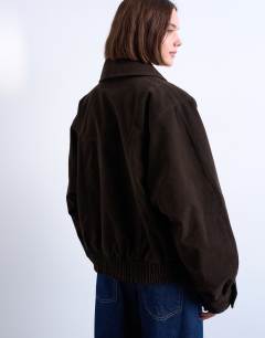 Model wearing Faux suede shawl bomber jacket in chocolate
