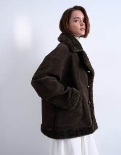 Model wearing Faux suede shearling oversized car coat in chocolate