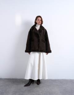 Model wearing Faux suede shearling oversized car coat in chocolate