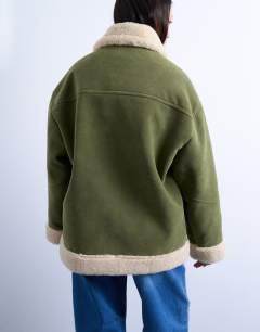 Model wearing Faux suede shearling oversized car coat in olive green