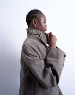 Model wearing Faux suede short car coat with neck tab in grey