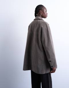 Model wearing Faux suede short car coat with neck tab in grey