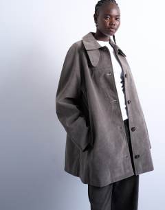 Model wearing Faux suede short car coat with neck tab in grey