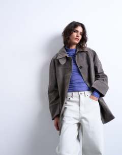 Model wearing Faux suede short funnel neck car coat with neck tab in grey