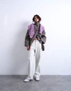 Model wearing Faux suede short funnel neck car coat with neck tab in grey