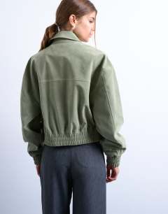 Model wearing Faux suede short jacket with patch pockets in sage