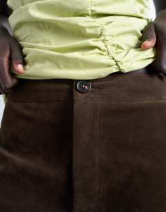 Model wearing Faux suede wide leg trouser with seam detail in brown