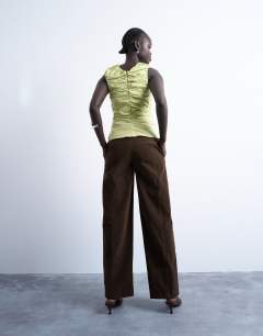 Model wearing Faux suede wide leg trouser with seam detail in brown