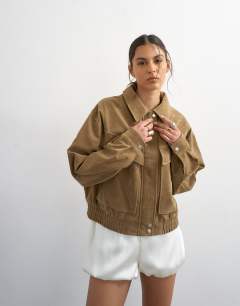 Model wearing Faux suede zip through bomber jacket in tan