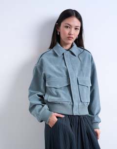 Model wearing Faux suede zip through jacket with patch pockets in blue