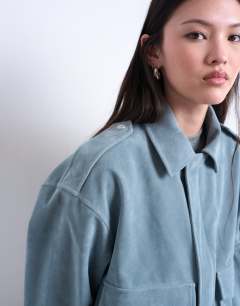 Model wearing Faux suede zip through jacket with patch pockets in blue