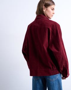 Model wearing Faux suede zip through seam detail jacket in burgundy